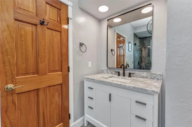 a view of an empty room with wooden walls