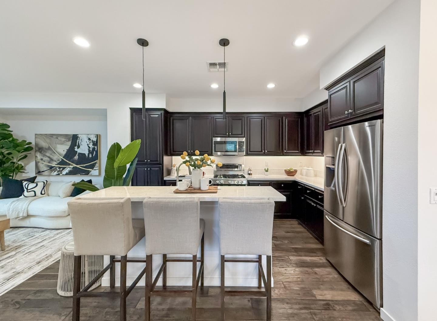 311 Geary Way Mountain View, CA 94041 - Photo 11 of 46 a kitchen with granite countertop a refrigerator a stove a dining table and chairs