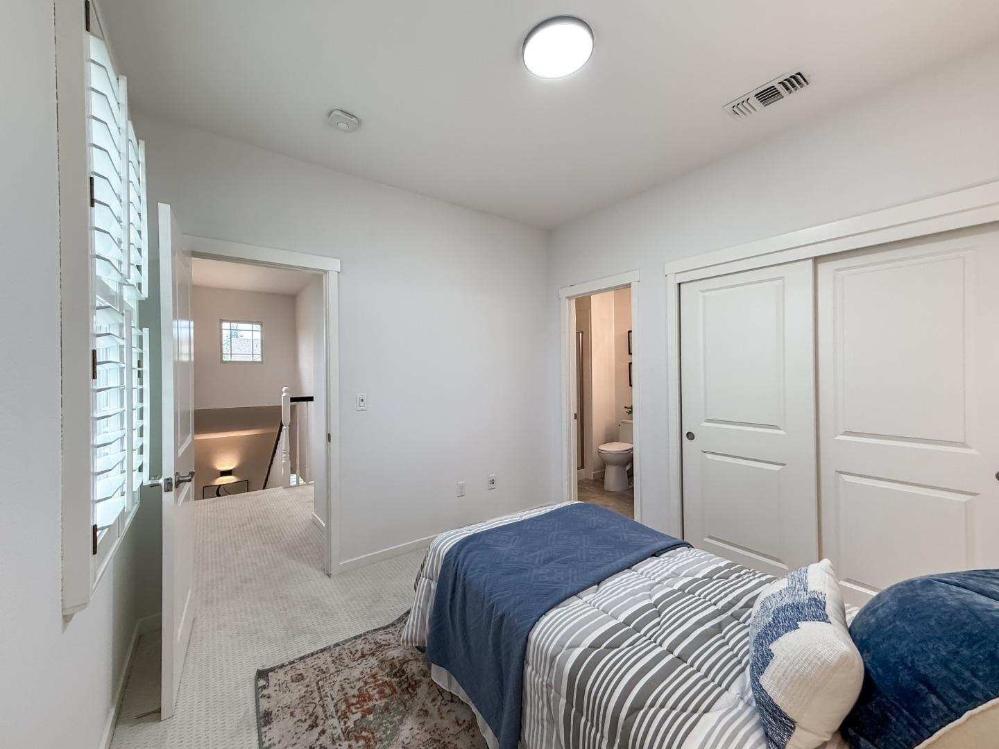 311 Geary Way Mountain View, CA 94041 - Photo 36 of 46 a bedroom with a bed and wooden floor