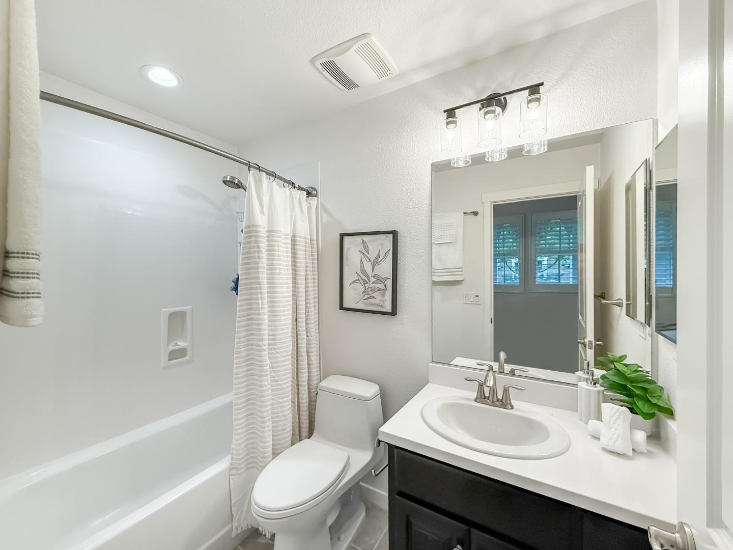 311 Geary Way Mountain View, CA 94041 - Photo 8 of 46 a bathroom with a sink vanity mirror and toilet