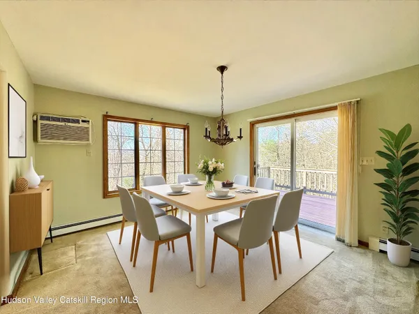 a view of a dining room with furniture window and outside view