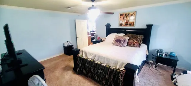 a bedroom with a bed and window