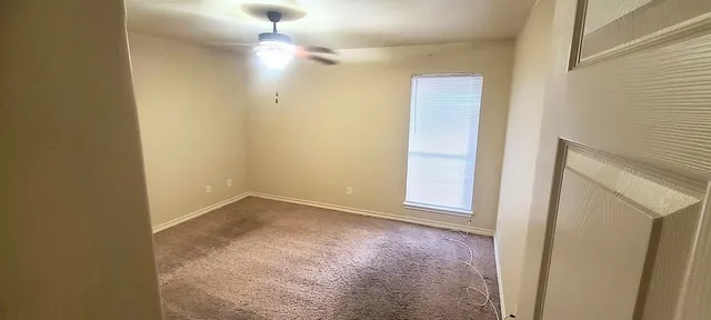 an empty room with a bathroom