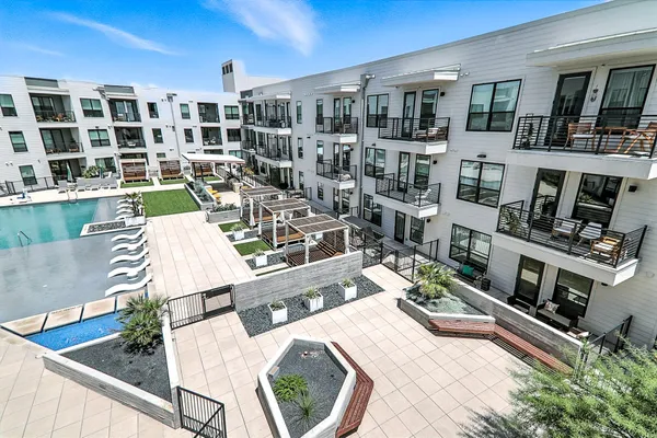 a view of a patio with table and chairs