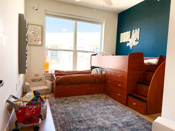 a bedroom with furniture and a window