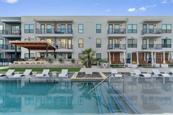 a view of pool with outdoor seating