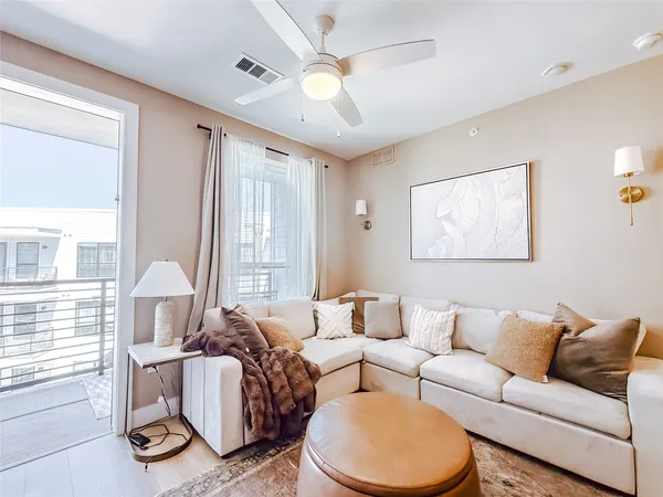 a living room with furniture and a window