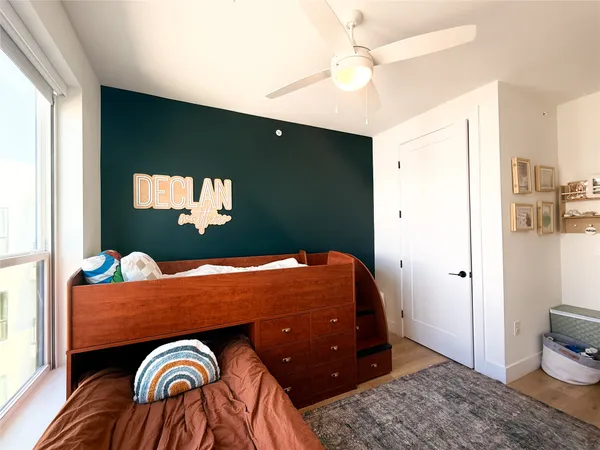 a bedroom with a bed and a dresser