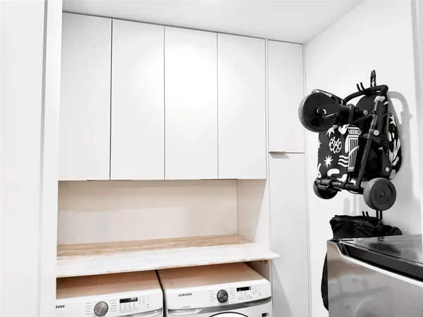 a view of bathroom with a sink and cabinets