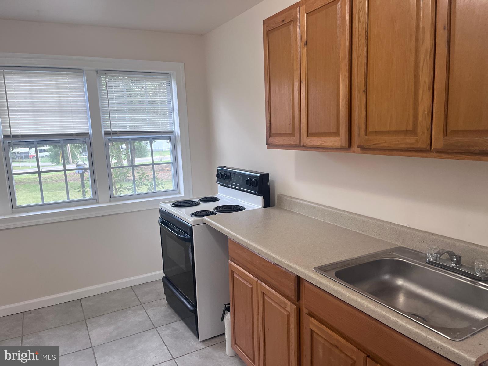 8617 Woodyard Road Clinton, MD 20735 - Photo 20 of 51 a kitchen with a stove and a sink