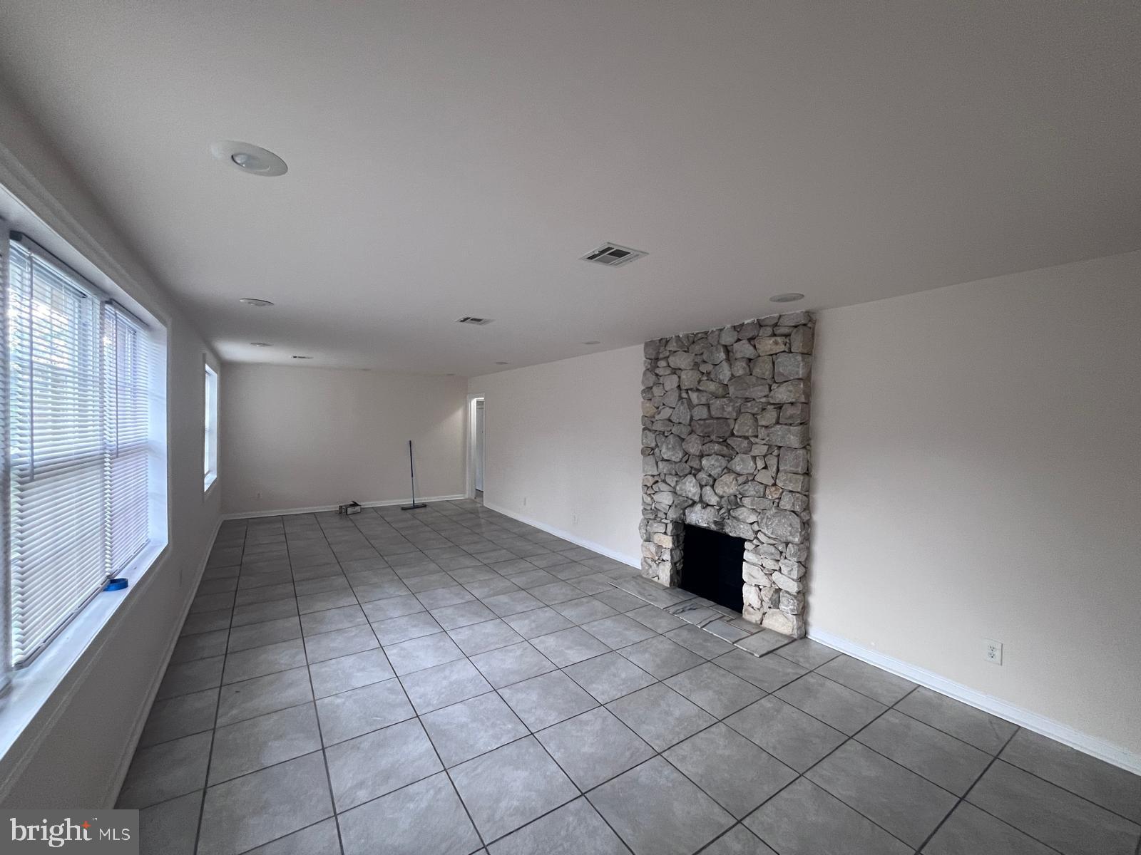 8617 Woodyard Road Clinton, MD 20735 - Photo 25 of 51 a view of a room with a fireplace and window
