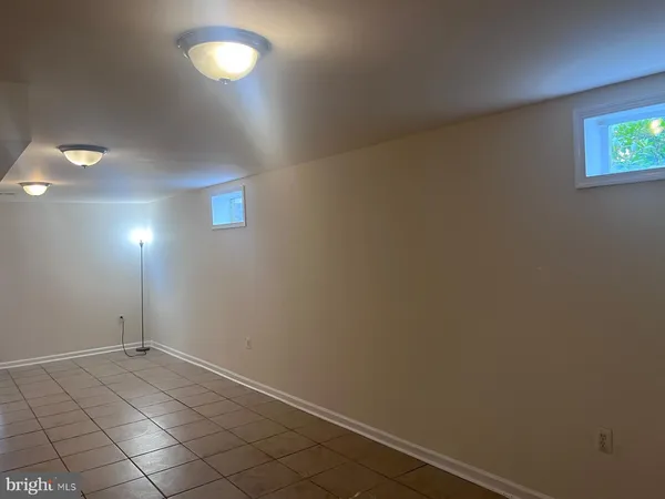 an empty room with a empty space and window