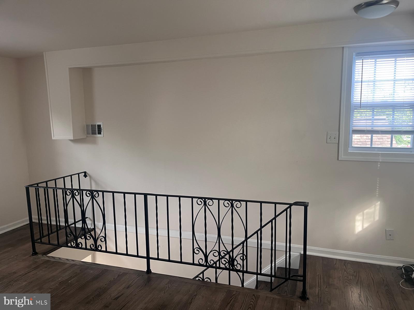 8617 Woodyard Road Clinton, MD 20735 - Photo 4 of 51 a view of staircase with white walls and window