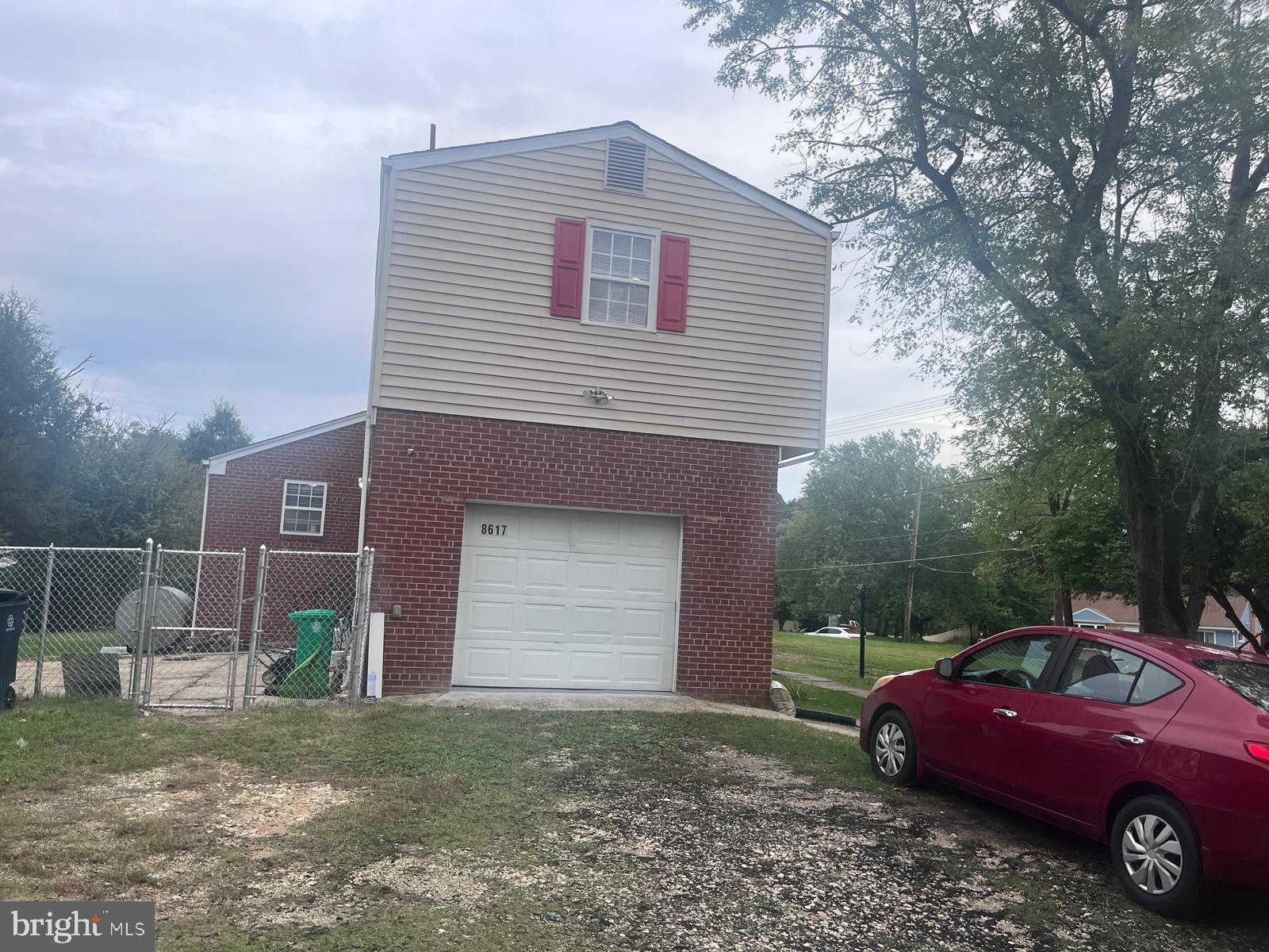 8617 Woodyard Road Clinton, MD 20735 - Photo 42 of 51 a front view of a house with a yard and garage