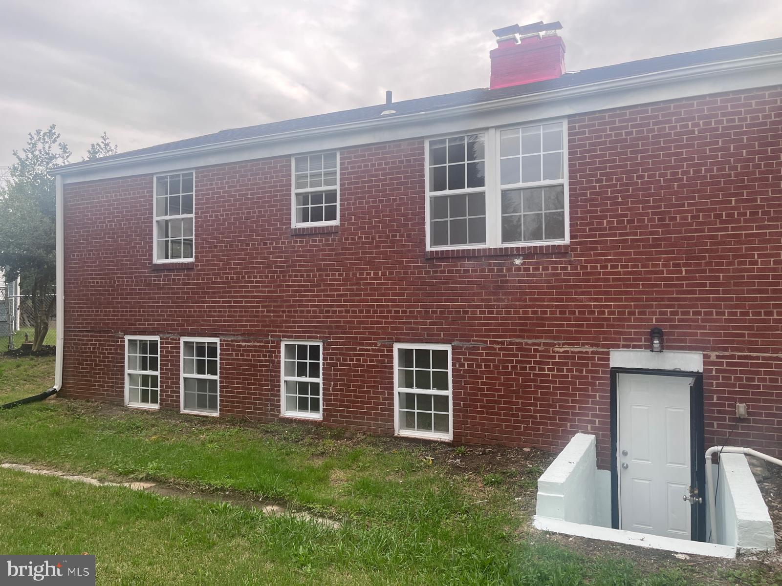 8617 Woodyard Road Clinton, MD 20735 - Photo 45 of 51 a front view of a house with a garden