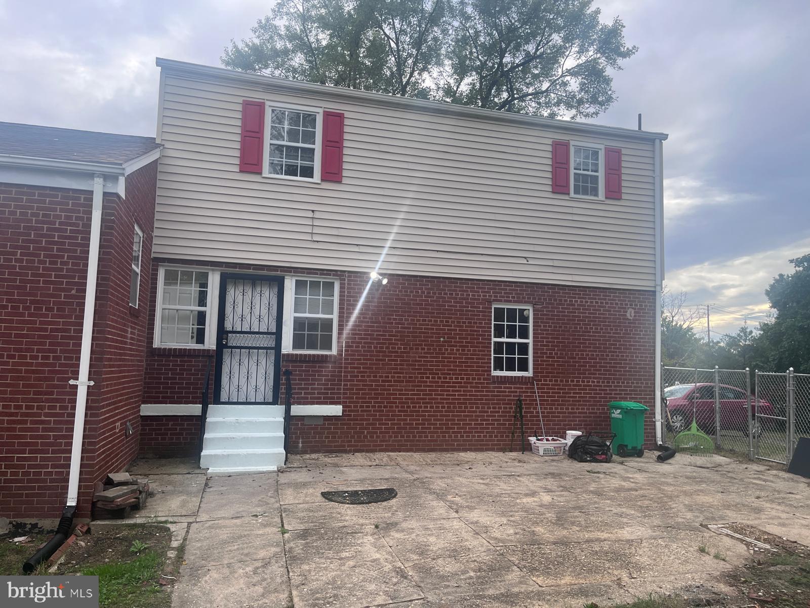 8617 Woodyard Road Clinton, MD 20735 - Photo 49 of 51 a front view of a house with a yard and garage
