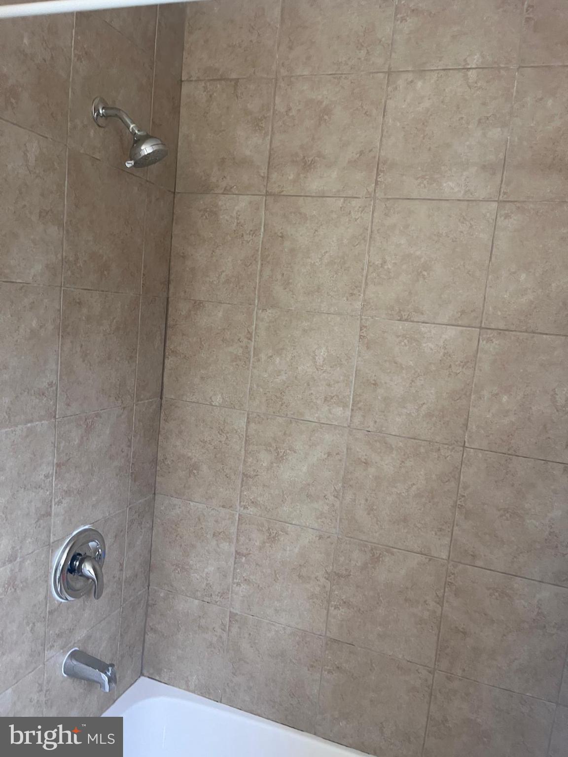 8617 Woodyard Road Clinton, MD 20735 - Photo 7 of 51 a bathroom with a toilet and a shower