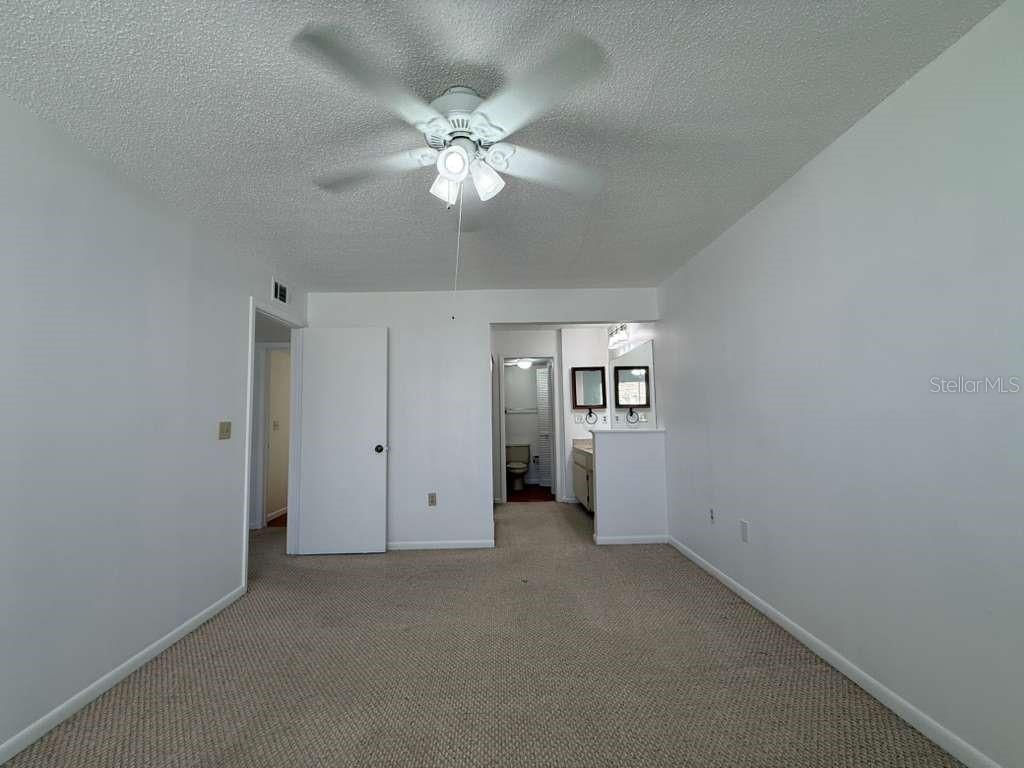 5333 Vineland Road, Unit 101 Orlando, FL 32811 - Photo 11 of 19 an empty room with a view of a livingroom