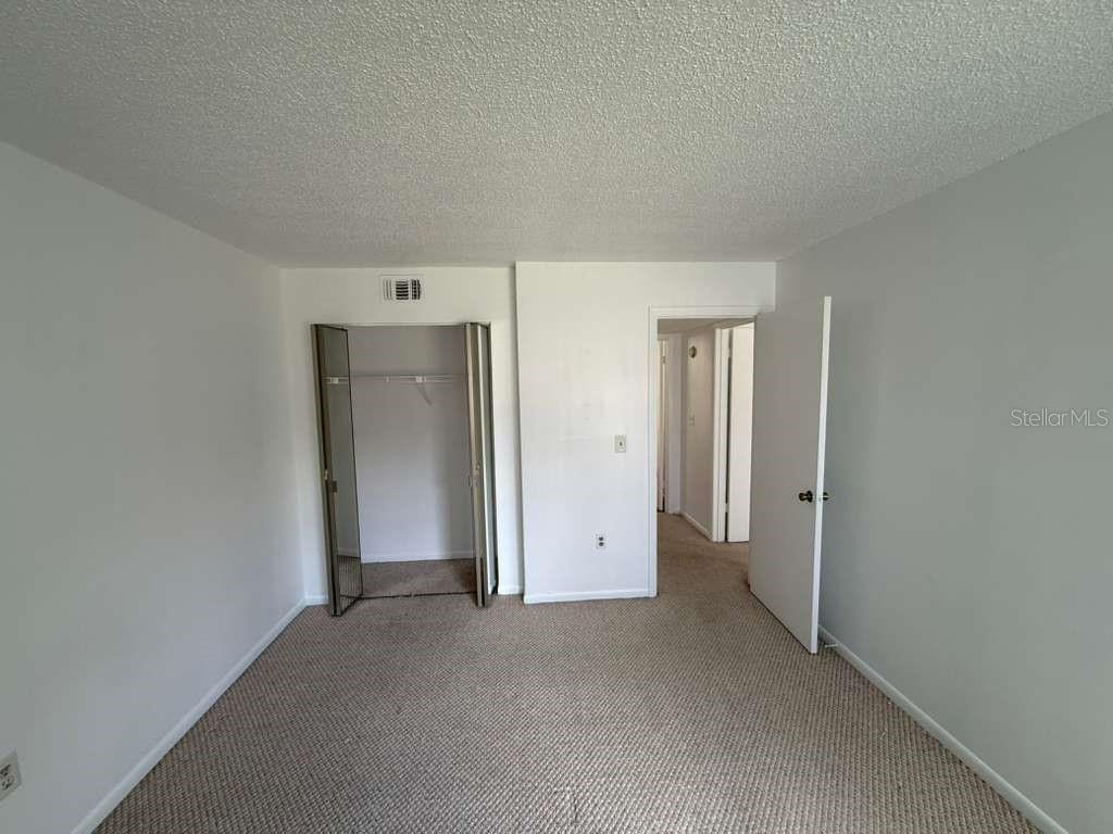 5333 Vineland Road, Unit 101 Orlando, FL 32811 - Photo 15 of 19 a view of an empty room and closet area