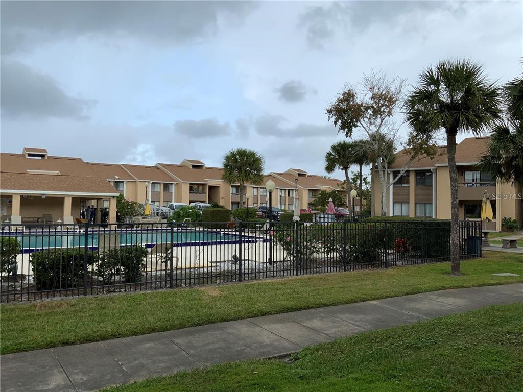 5333 Vineland Road, Unit 101 Orlando, FL 32811 - Photo 19 of 19 a front view of a house with a garden
