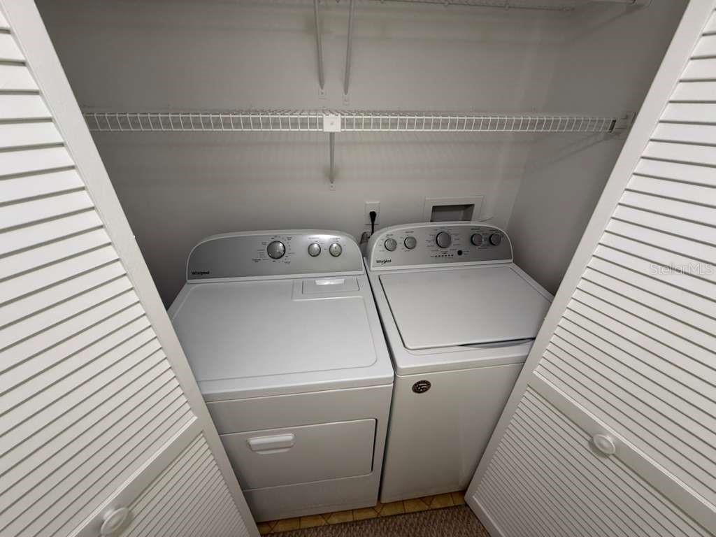 5333 Vineland Road, Unit 101 Orlando, FL 32811 - Photo 10 of 19 a utility room with dryer and washer