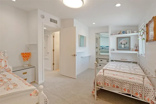 a bedroom with a bed and a cabinets