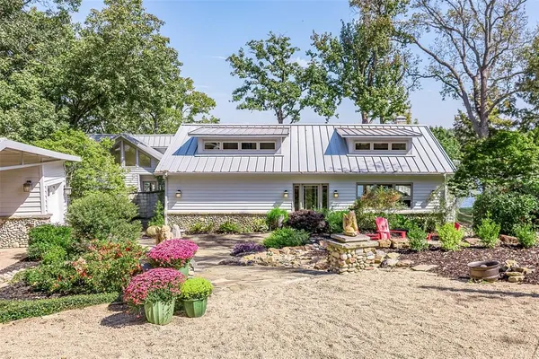 a front view of a building with garden