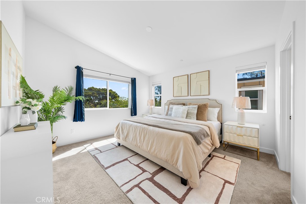 23238 Marigold Avenue Torrance, CA 90502 - Photo 24 of 38 a spacious bedroom with a bed and a window