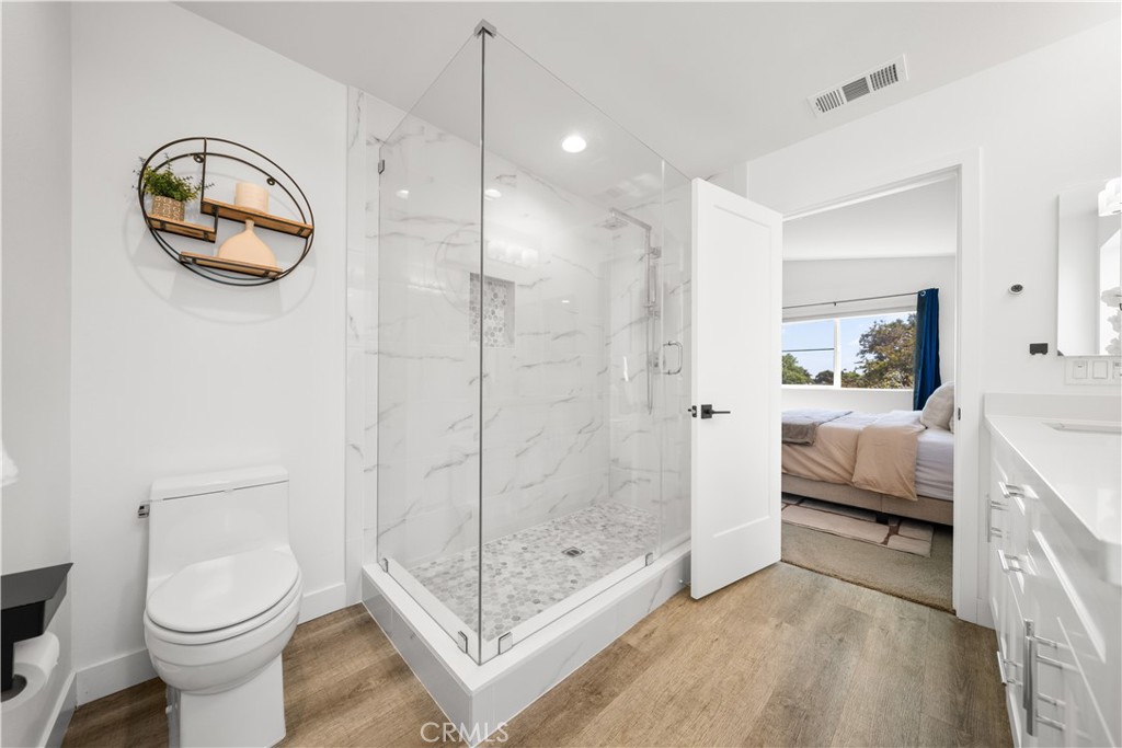 23238 Marigold Avenue Torrance, CA 90502 - Photo 28 of 38 a spacious bathroom with a toilet a sink and shower