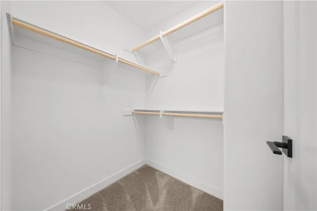 a view of empty room with white walls