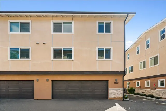 a front view of a house with garage
