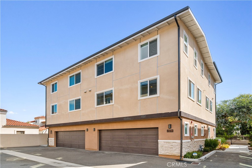 23238 Marigold Avenue Torrance, CA 90502 - Photo 34 of 38 a front view of a house with garage