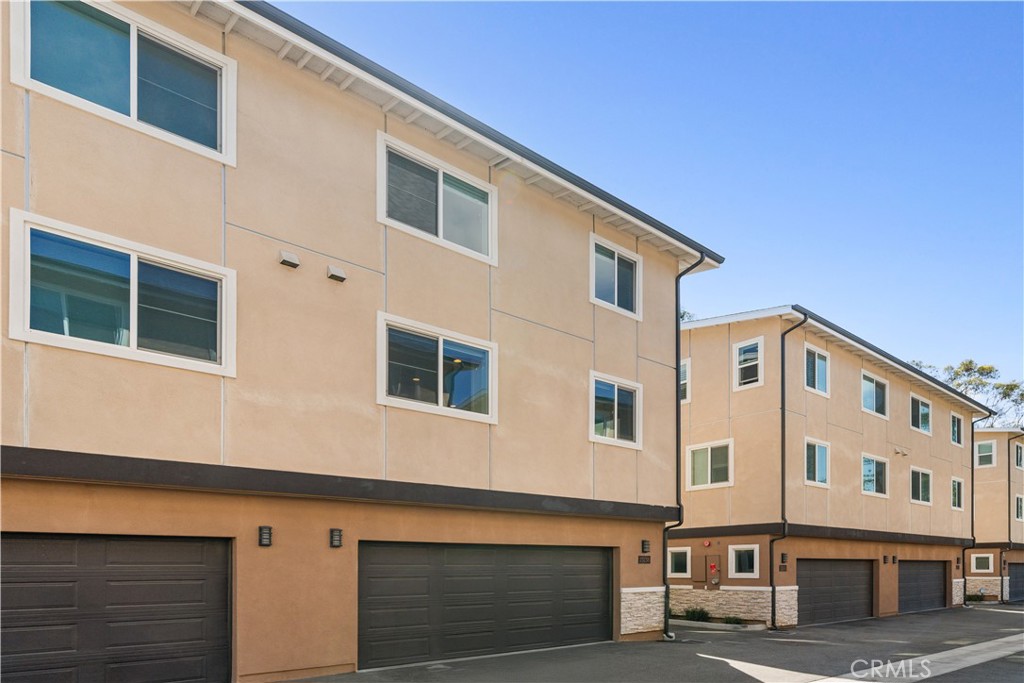 23238 Marigold Avenue Torrance, CA 90502 - Photo 35 of 38 a front view of a building with large windows
