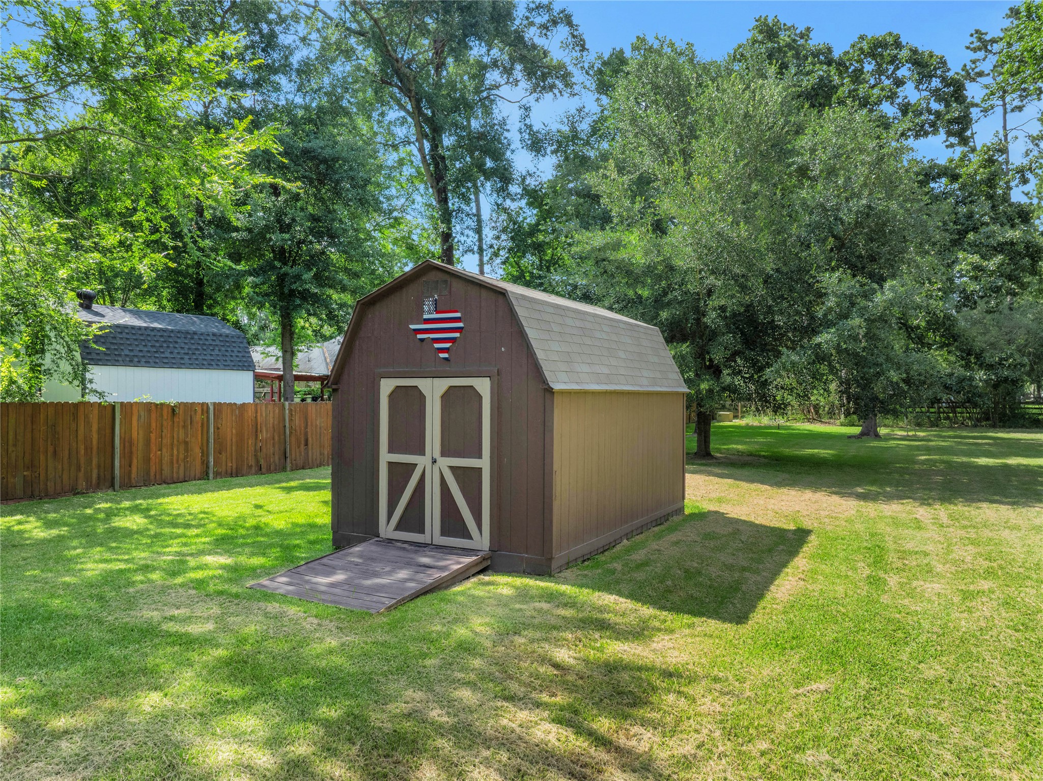 15418 Willis Way Conroe, TX 77384 - Photo 13 of 41 Storage shed with electricity.