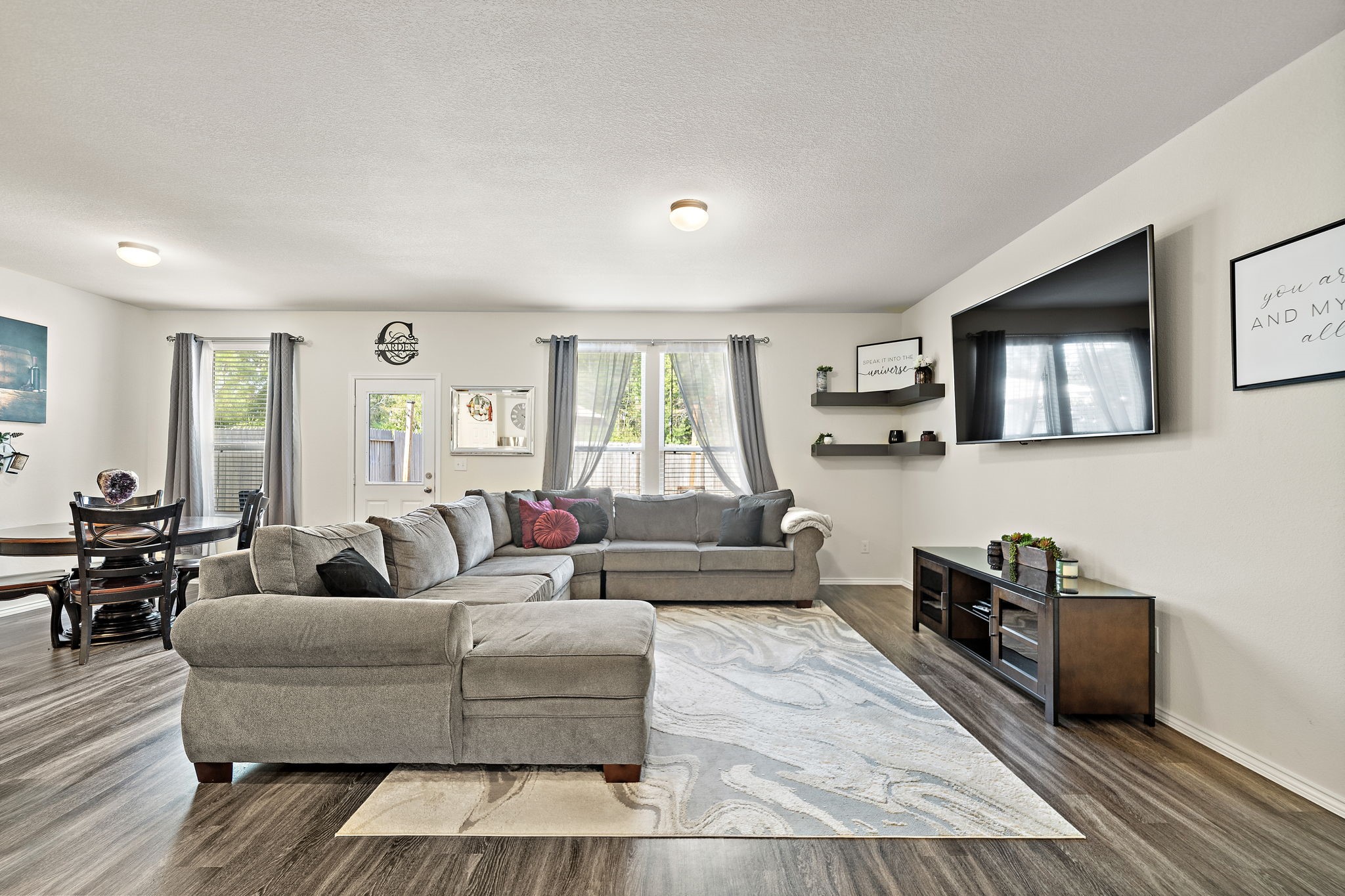 4210 Amber Ruse Drive Conroe, TX 77304 - Photo 9 of 45 Spacious living room with natural light from windows.