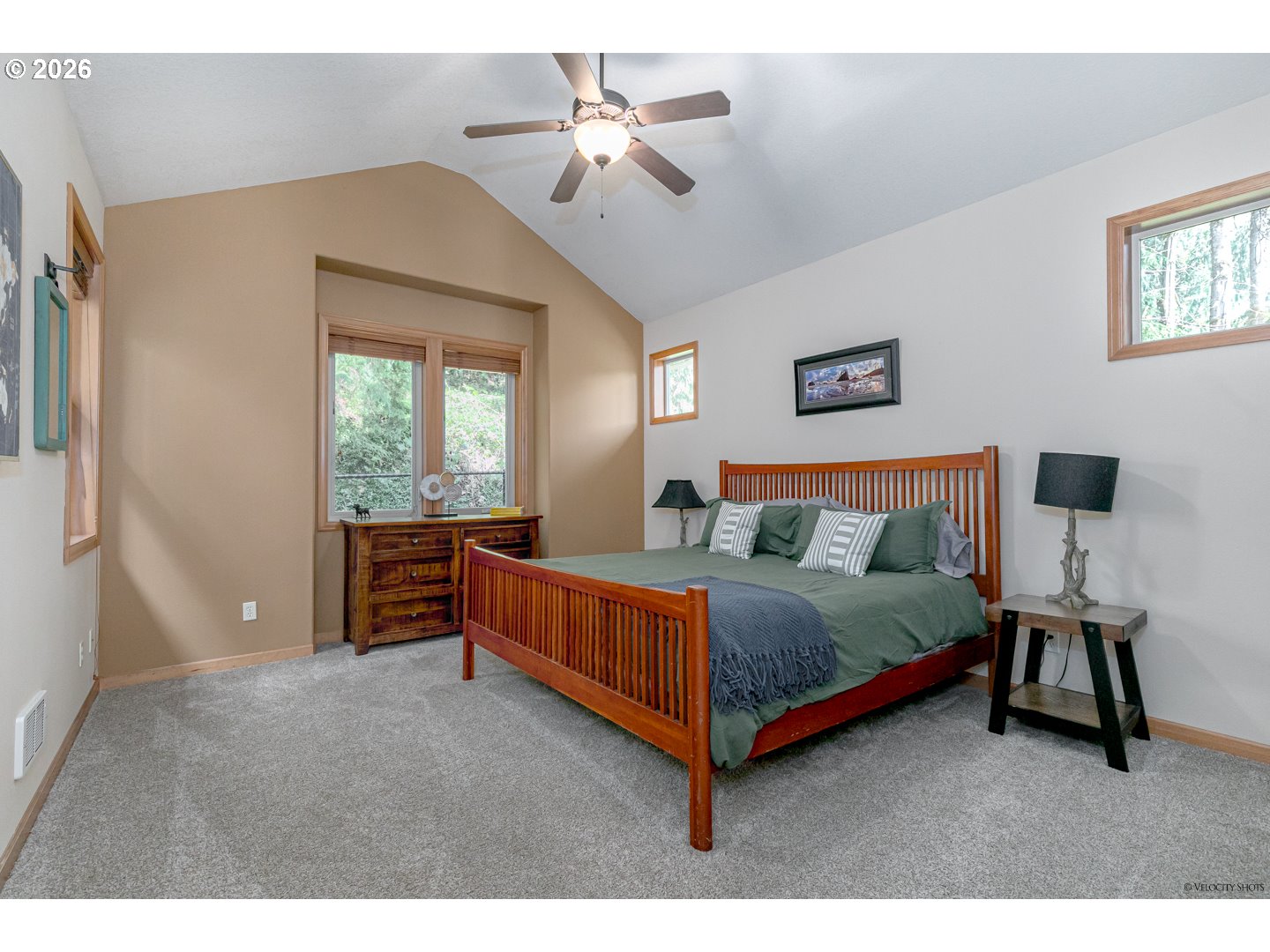64636 Mc Intyre Road Rhododendron, OR 97049 - Photo 22 of 48 a bedroom with a bed and a chandelier