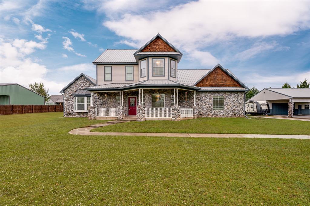 496 Brandon Way Pottsboro, TX 75076 - Photo 1 of 1 a front view of a house with swimming pool having outdoor seating