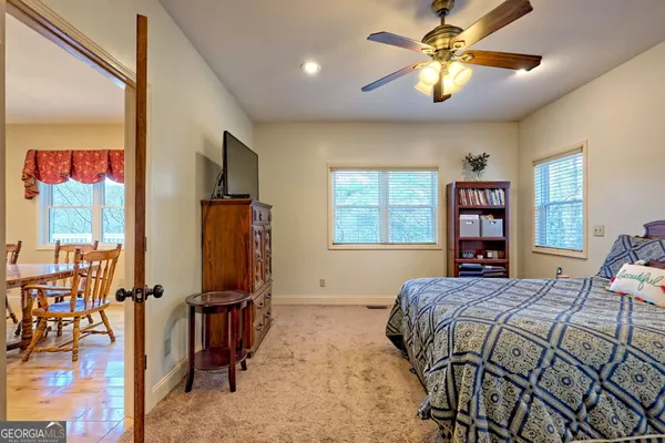a view of an entryway with wooden floor