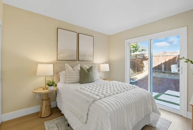 a bedroom with a bed and window