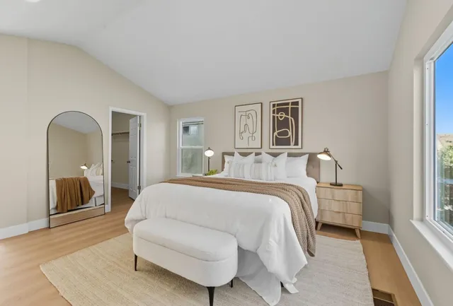 a bedroom with a bed and a couch