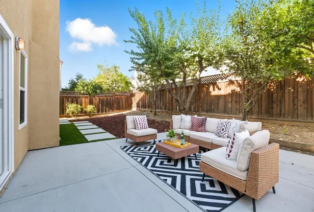 a view of outdoor sitting area with furniture