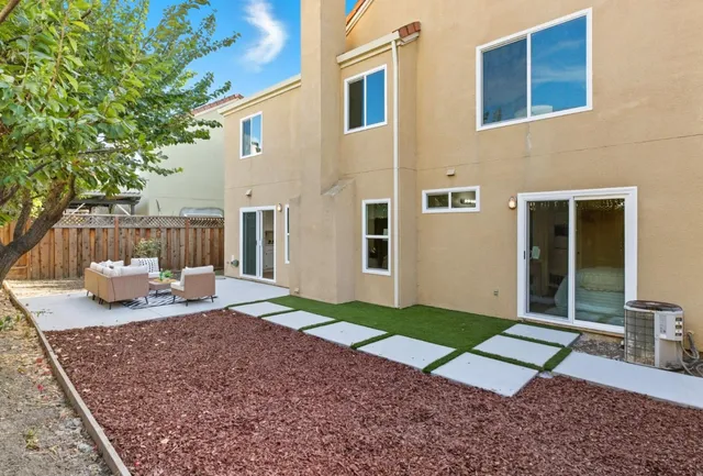 a view of a backyard with a patio