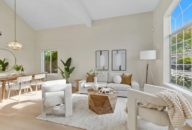 a living room with furniture and a lamp