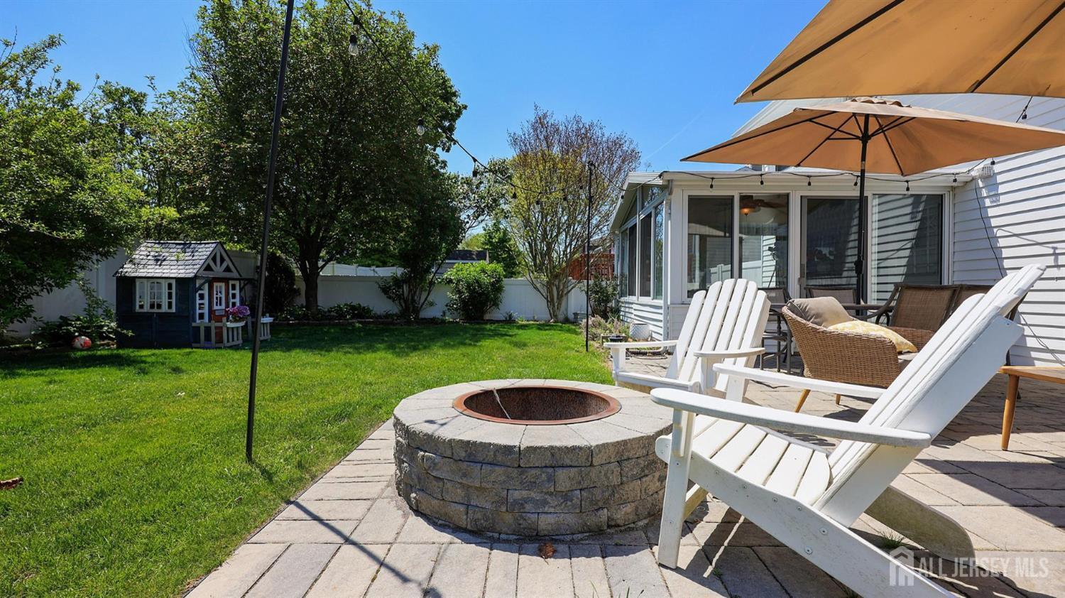 47 Miliken Road Colonia, NJ 07067 - Photo 32 of 40 a view of a house with backyard sitting area and garden