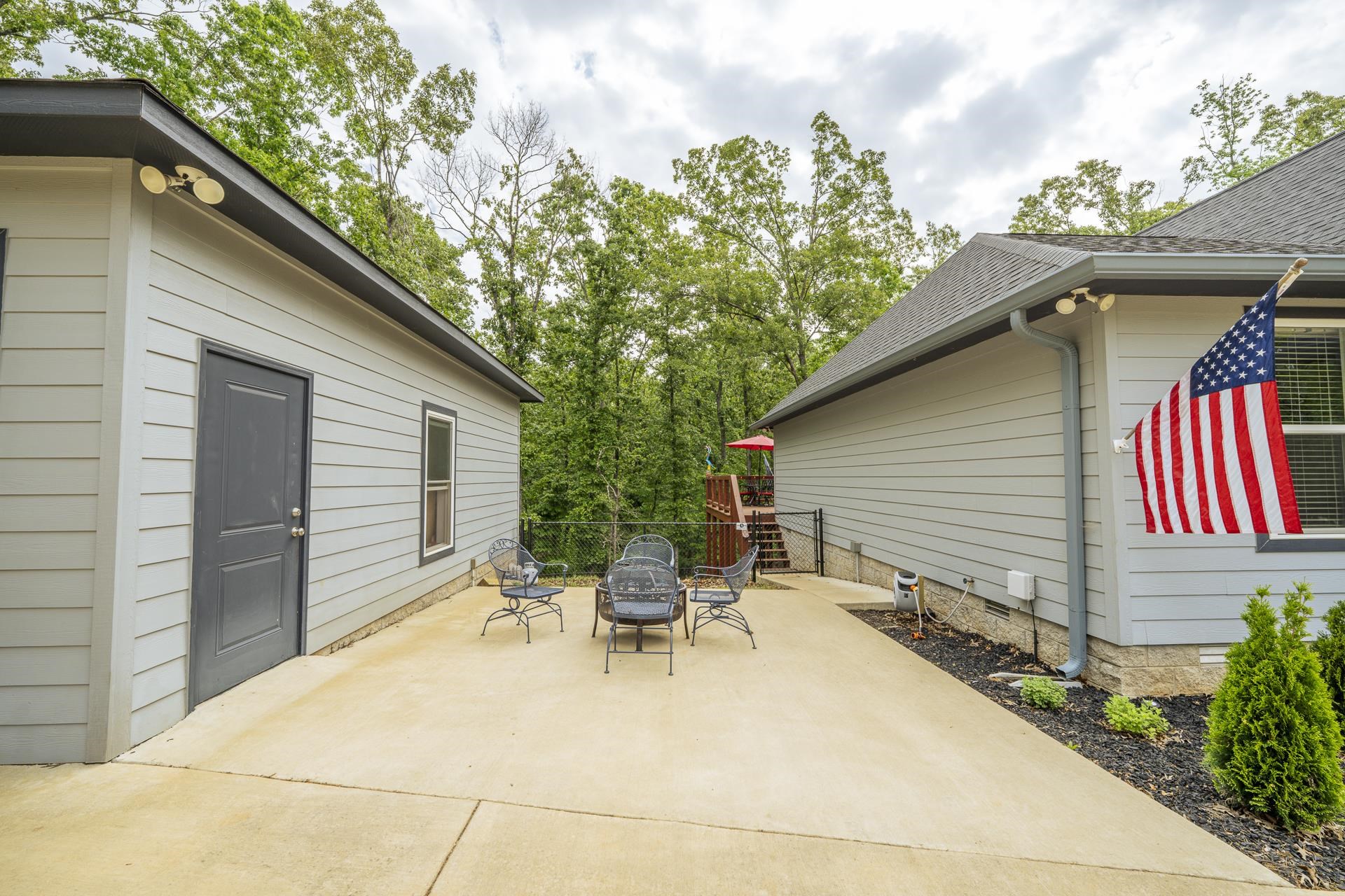 315 Timber Ridge Drive Counce, TN 38326 - Photo 25 of 40 a backyard of a house with table and chairs