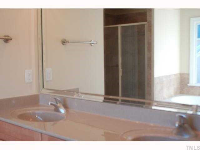 3614 Pickett Road Durham, NC 27705 - Photo 7 of 12 Warm tiles and sunken tub highlight this 5 piece master bathroom
