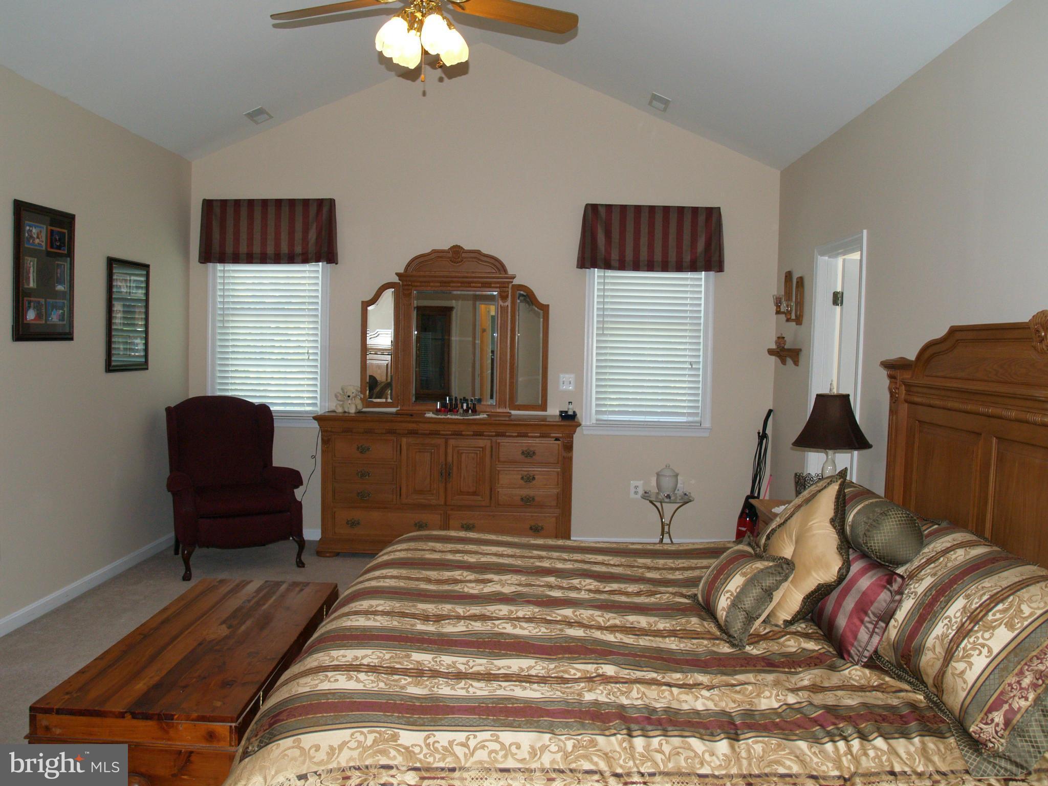 92 Friendship Road Friendship, MD 20758 - Photo 12 of 27 a bedroom with a bed and a dresser in it