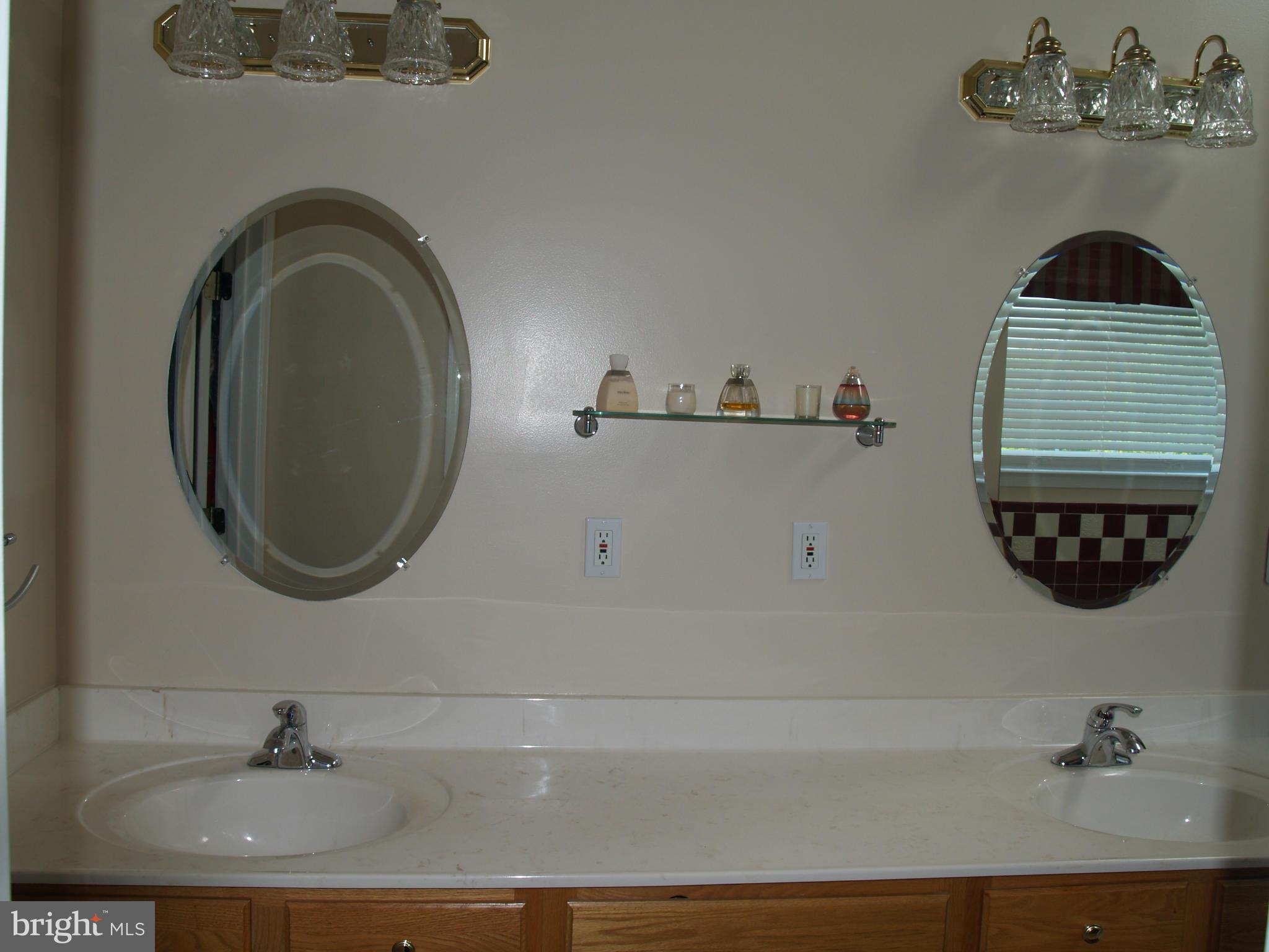 92 Friendship Road Friendship, MD 20758 - Photo 13 of 27 a bathroom with a sink and a mirror