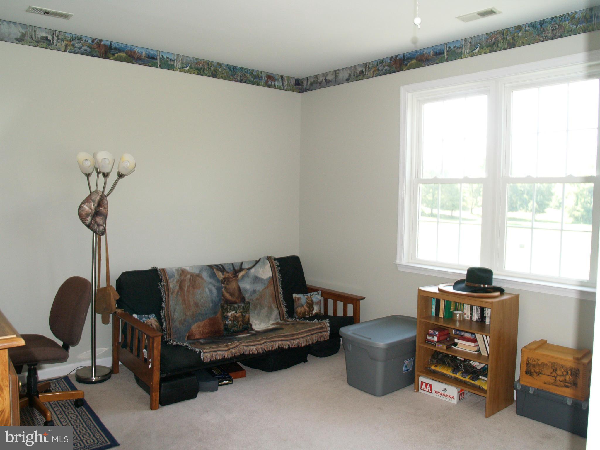 92 Friendship Road Friendship, MD 20758 - Photo 16 of 27 a living room with furniture and a window