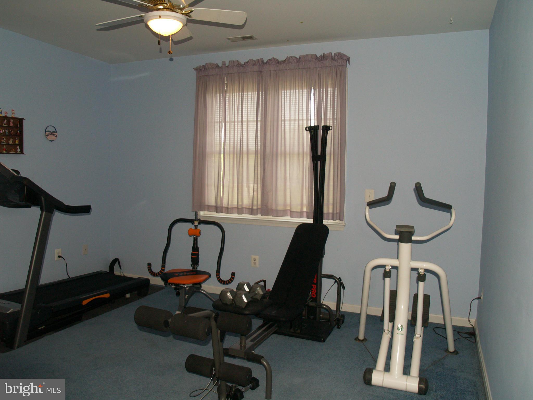 92 Friendship Road Friendship, MD 20758 - Photo 17 of 27 a view of a room with gym equipment